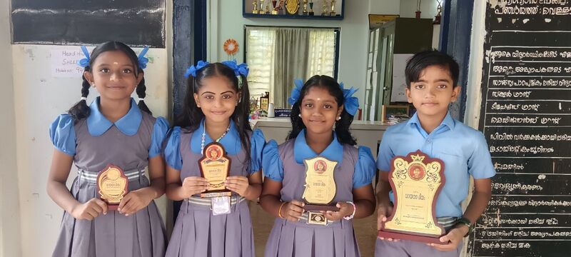 പ്രമാണം:23434-reading dayprize.jpeg