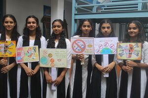 21001 children with pluck card.resized.JPG