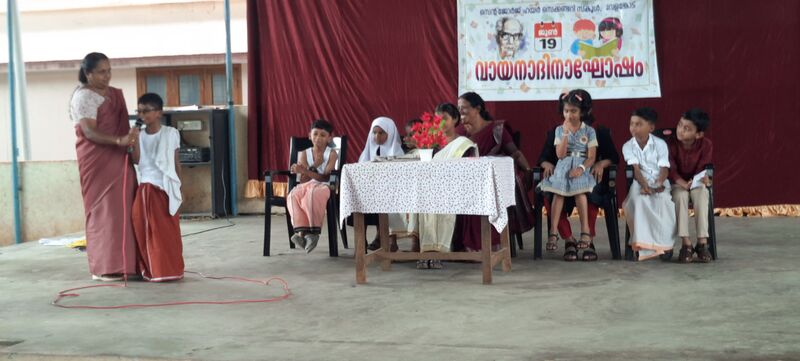 പ്രമാണം:47026-reading day7.jpg