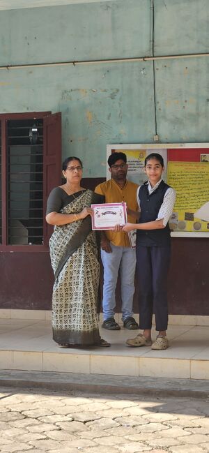 NithyaKVhm awarding prize17100.jpeg
